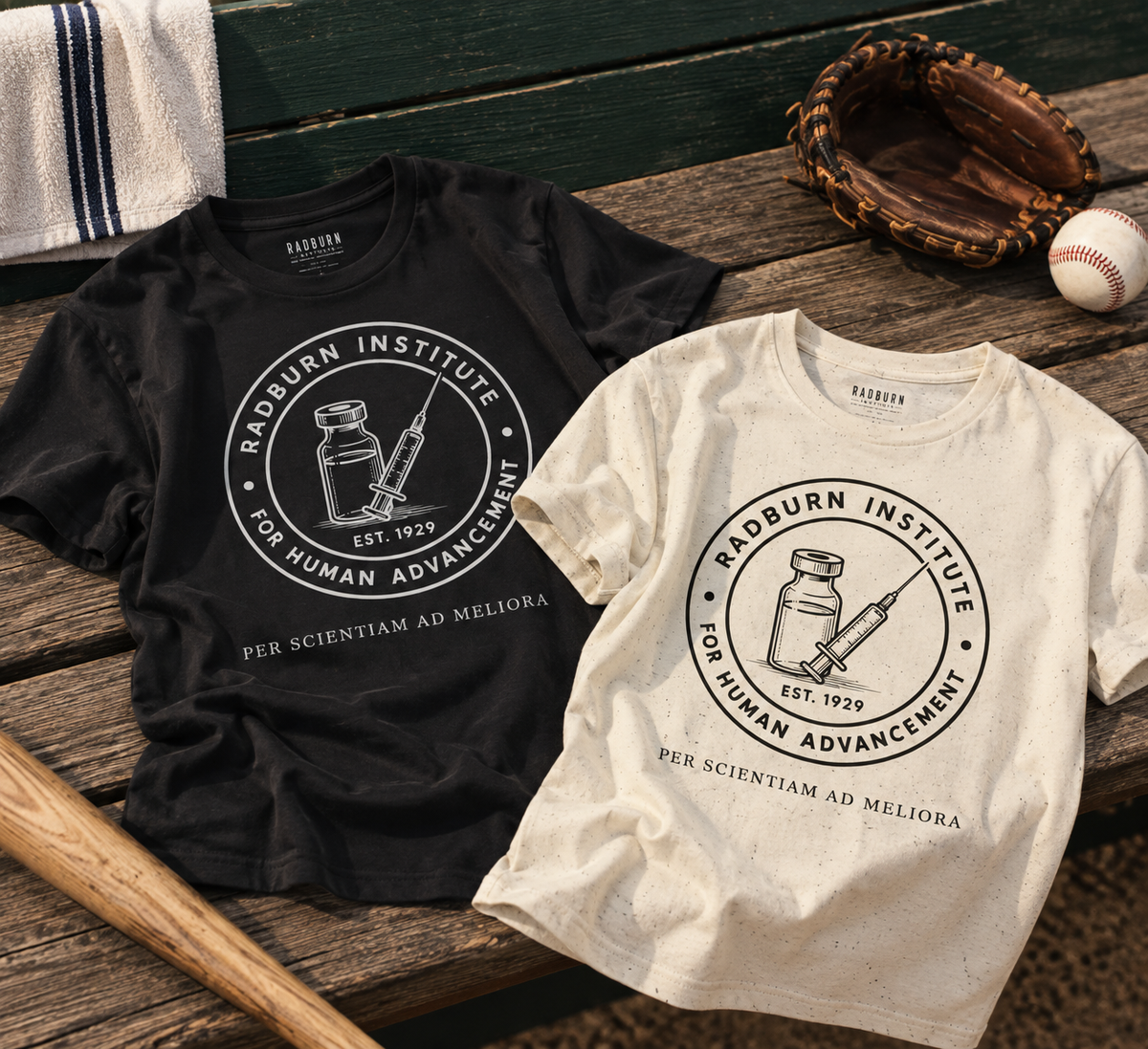 Black and natural Radburn Institute Seal Garments arranged with baseball equipment | color:Natural
