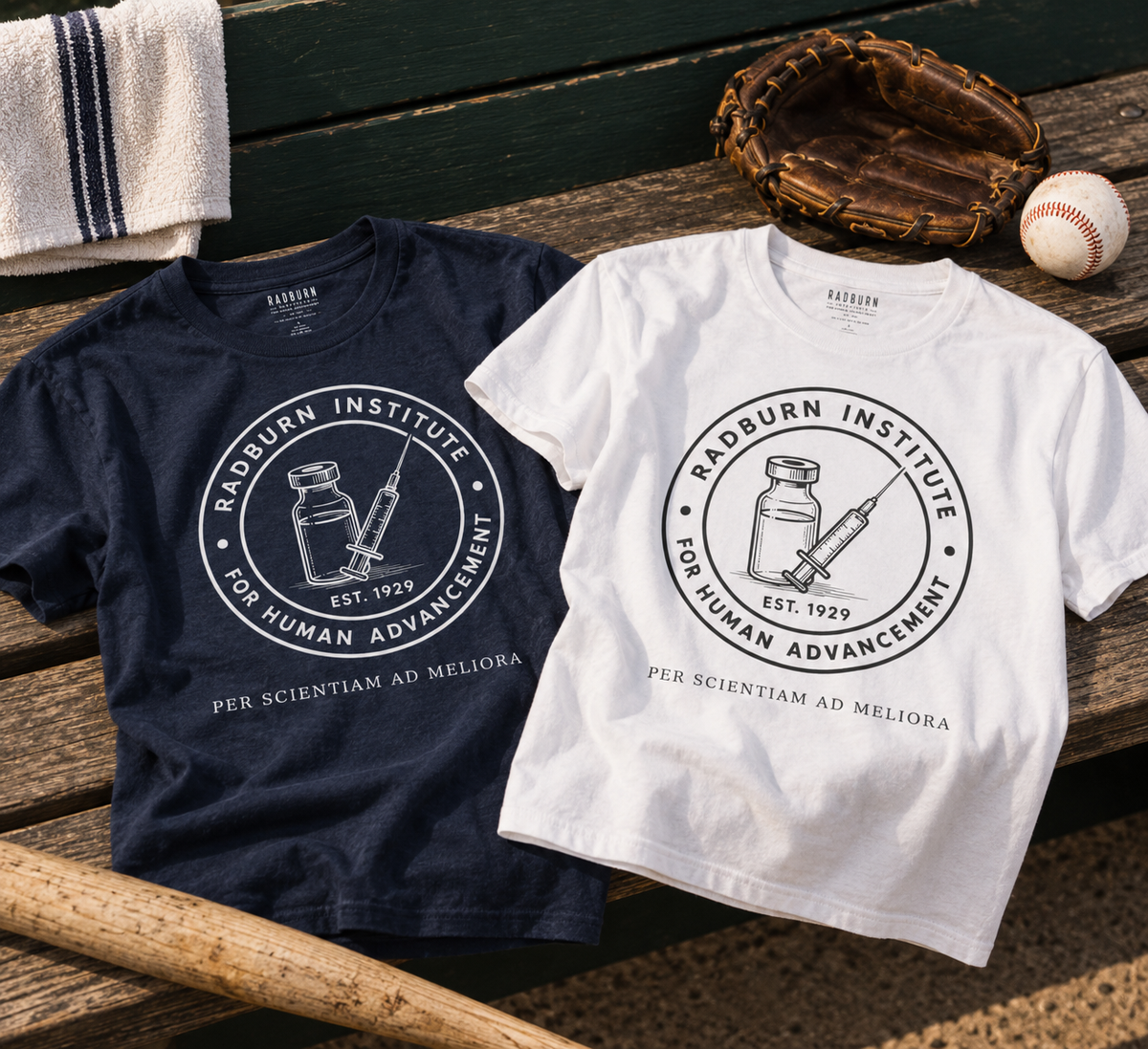 Navy and white Radburn Institute Seal Garments arranged with baseball equipment | color:Navy