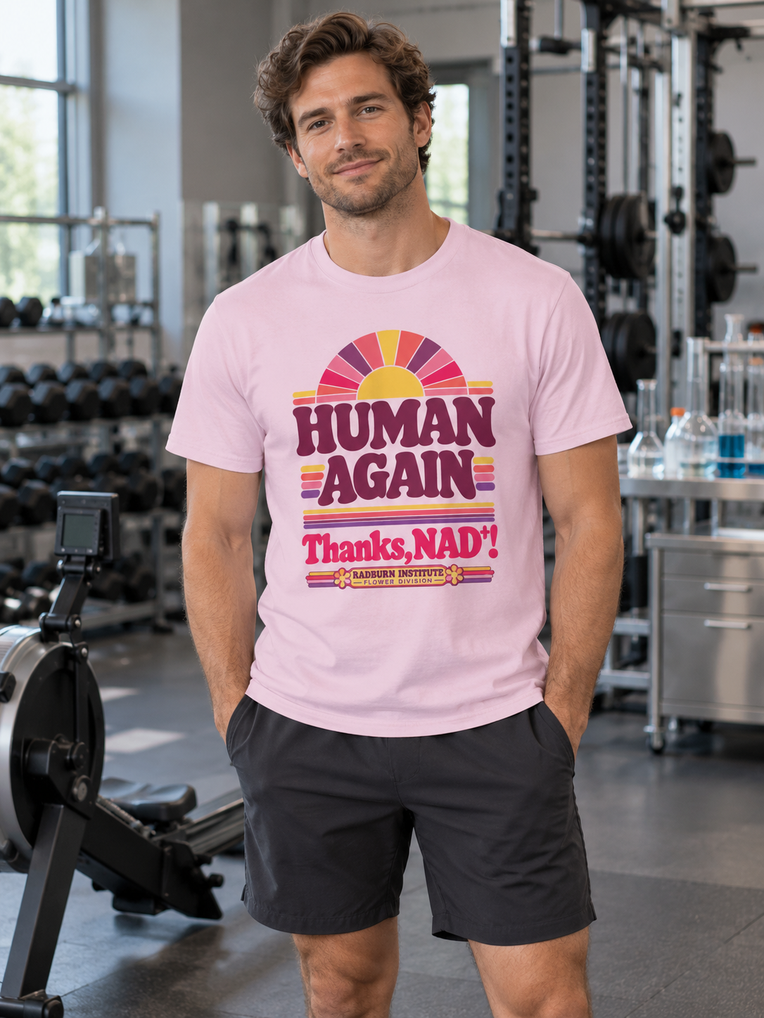 Man wearing light pink Human Again NAD+ T-shirt in a laboratory gym | color:Light_Pink
