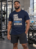 Man wearing navy Withstand. A GLOW T-Shirt in a laboratory gym | color:Navy